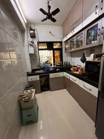 Kitchen in 2 BHK Apartment at Neel Orchid CHS, Khanda Colony – for Rent