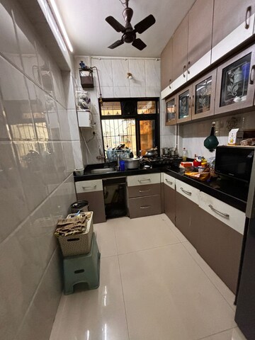 Kitchen in 2 BHK Apartment at Neel Orchid CHS, Khanda Colony – for Rent