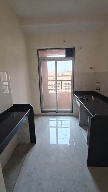 Kitchen in 1 BHK Apartment at Kanchan Pushp Society, Ghodbunder Road – for Sale