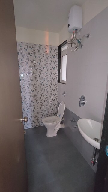 Attached Bathroom in 1 BHK Apartment at Kanchan Pushp Society, Ghodbunder Road – for Sale