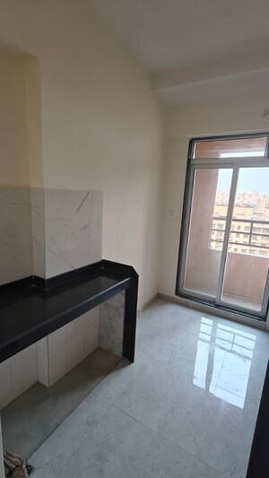 Kitchen in 1 BHK Apartment at Kanchan Pushp Society, Ghodbunder Road – for Sale