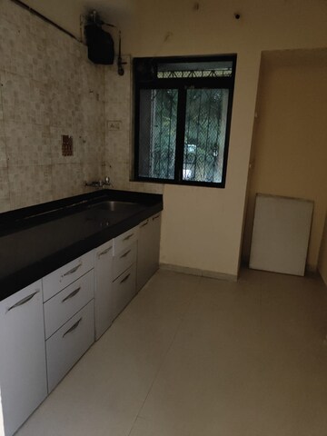 Kitchen in 1 BHK Apartment at Vijay Garden, Ghodbunder Road – for Sale
