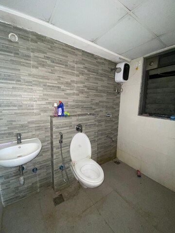 Bathroom in 1.5 BHK Apartment at Lodha Palava City Lakeshore Greens, Dombivli East – for Rent