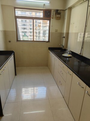 Kitchen in 1 BHK Apartment at Vijay Garden, Ghodbunder Road – for Sale