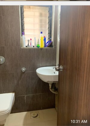 Bathroom in 1 BHK Apartment at Raunak Unnathi Woods Phase 6, Ghodbunder Road – for Sale