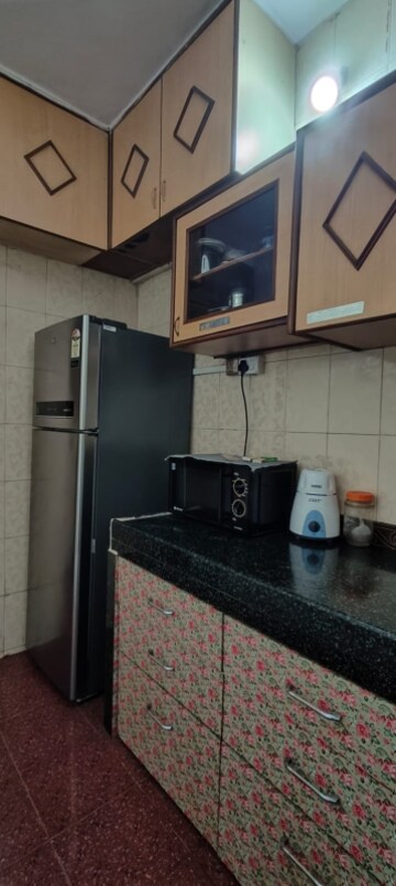 Kitchen in 2 BHK Apartment at Soniya CHS, Sector 4a Kopar Khairane – for Rent