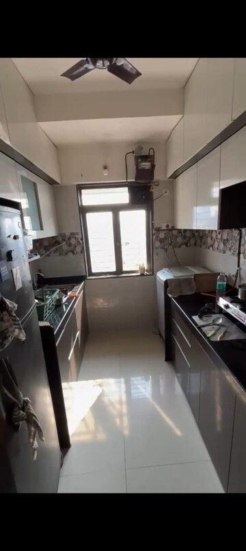 Kitchen in 1.5 BHK Apartment at Hiranandani Estate Crown, Ghodbunder Road – for Rent
