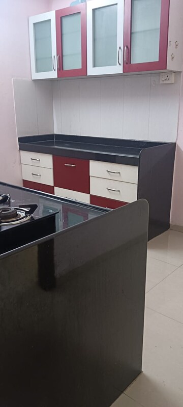Kitchen in 2 BHK Apartment at Shree Satya Shankar Residency, Manpada – for Rent