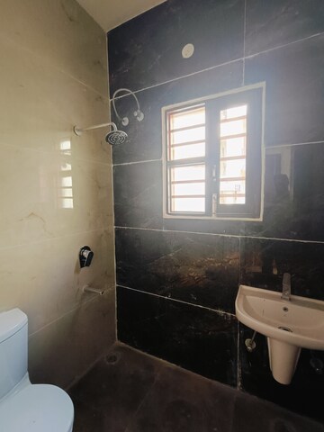 Bathroom in 3 BHK Apartment at Sunny Enclave – for Rent