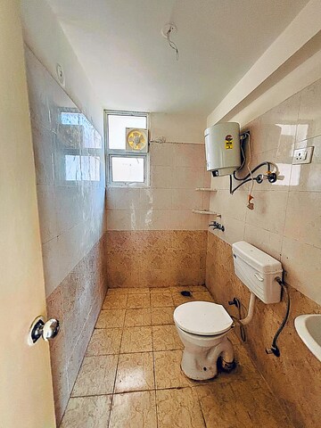Bathroom in 2 BHK Apartment at Shree Vardhman Green Court, Sector 90 – for Rent