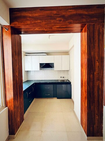 Kitchen in 2 BHK Apartment at Shree Vardhman Green Court, Sector 90 – for Rent