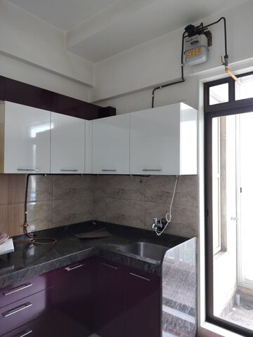 Kitchen in 3 BHK Apartment at Harmony Sky Suites, Ghodbunder Road – for Rent
