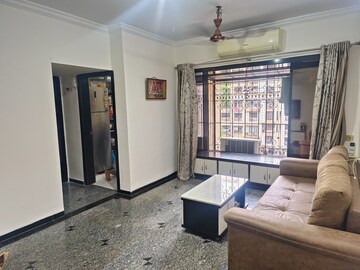 Living Room in 1 BHK Apartment at Dheeraj Presidency, Kandivali West – for Sale