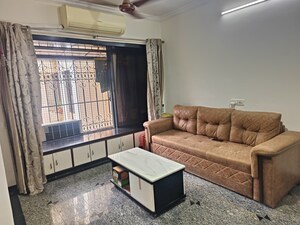 Living Room in 1 BHK Apartment at Dheeraj Presidency, Kandivali West – for Sale