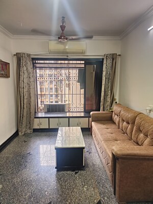 Living Room in 1 BHK Apartment at Dheeraj Presidency, Kandivali West – for Sale