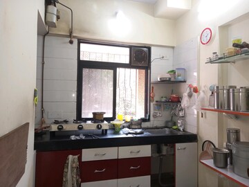 Kitchen in 1 BHK Apartment at Raunak Heights, Ghodbunder Road – for Sale