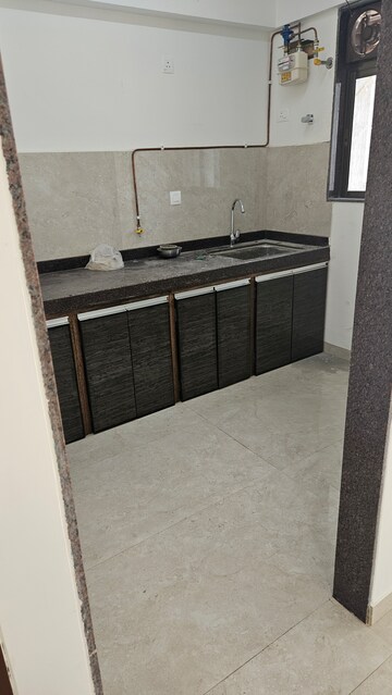 Kitchen in 1.5 BHK Apartment at New Ambivali, Andheri West – for Sale