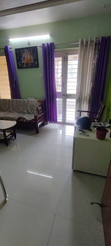 Living Room in 1 BHK Apartment at GK Dwarka Sai, Rahatani – for Rent
