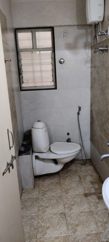 Bathroom in 1 BHK Apartment at GK Dwarka Sai, Rahatani – for Rent
