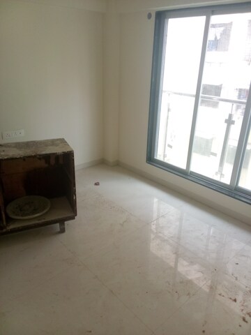 Living Room in 1 BHK Apartment at Rainbow CHS Goregaon West, Goregaon West – for Sale
