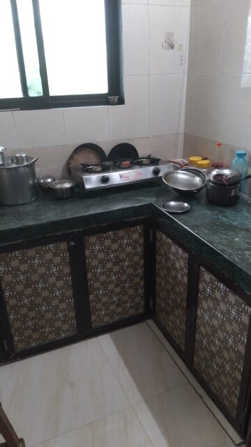 Kitchen in 2 BHK Apartment at Trisangam CHS, Dombivli West – for Rent