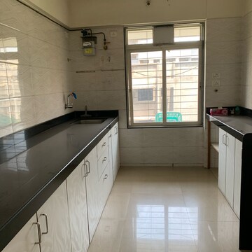 Kitchen in 2 BHK Apartment at Amar Jyoti Tower, Dalvi Nagar – for Sale