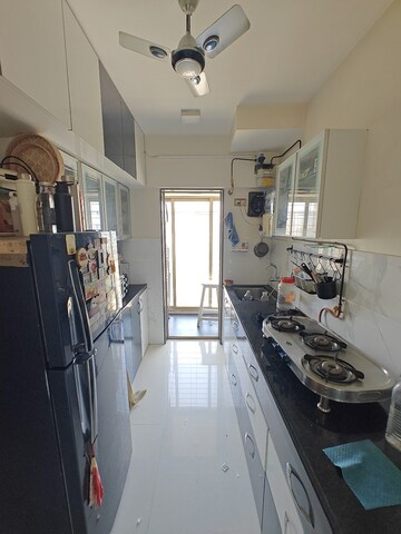 Kitchen in 2 BHK Apartment at Solitaire Heights, Malad West – for Rent