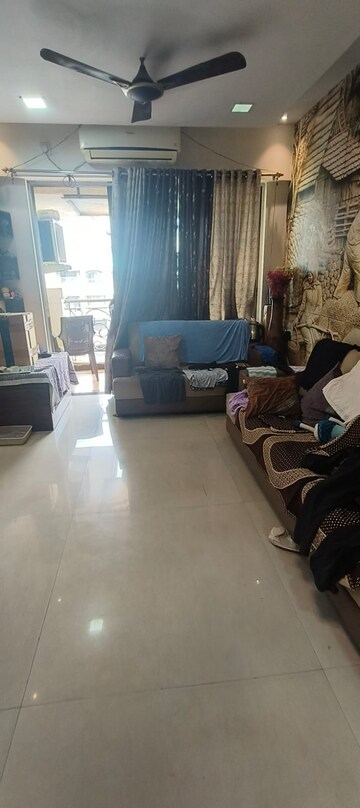 Living Room in 2 BHK Apartment at Tharwani Rosewood Heights, Kharghar Sector 10 – for Rent