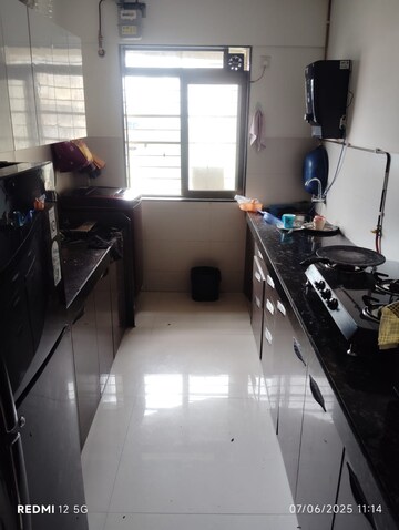 Kitchen in 2 BHK Apartment at Acme Ozone, Manpada – for Rent