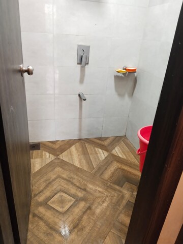 Bathroom in 1 BHK Apartment at Shree Tirupati STG Signature Residency, Patlipada – for Rent