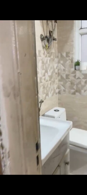Bathroom in 2.5 BHK Apartment at Rishabh Paradise, Abhay Khand – for Sale