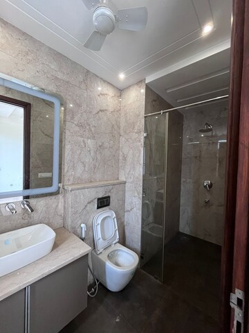 Bathroom in 4 BHK Apartment at Sushant Lok I – for Rent