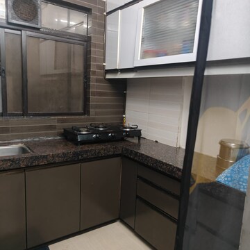 Kitchen in 2 BHK Apartment at Riddhi Gardens CHS, Malad East – for Rent