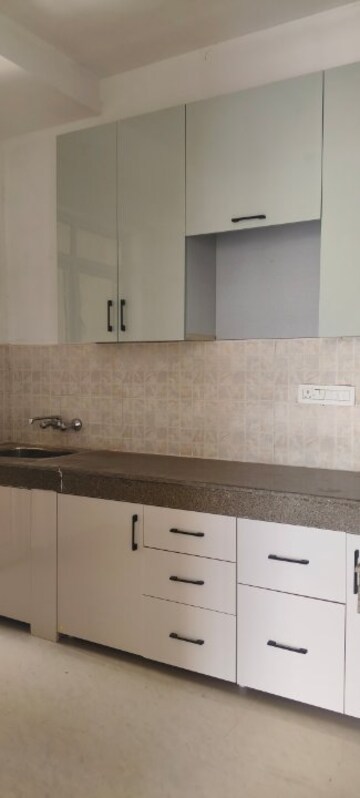 Kitchen in 2 BHK Apartment at ATS Allure, Sector 22d Yamuna Expressway – for Rent