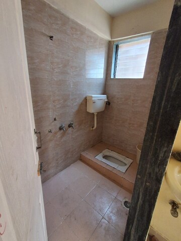 Bathroom in 2 BHK Apartment at Highland Windson Heights, Balkum Pada – for Rent