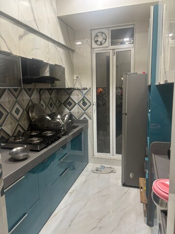 Kitchen in 3 BHK Apartment at Kalpa Taru Siddhachal III, Vasant Vihar – for Rent