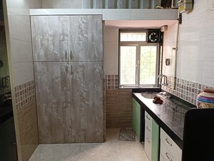 Kitchen in 1 BHK Apartment at Raj Ratna Park CHS, Brahmand – for Sale