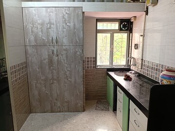 Kitchen in 1 BHK Apartment at Raj Ratna Park CHS, Brahmand – for Sale