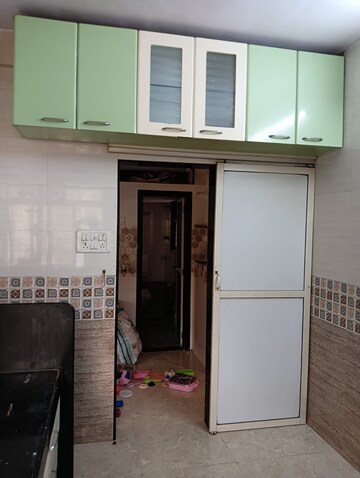 Kitchen in 1 BHK Apartment at Raj Ratna Park CHS, Brahmand – for Sale