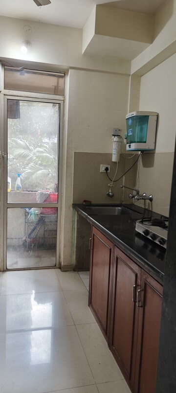 Kitchen in 1 BHK Apartment at Hiranandani Estate Flora, Ghodbunder Road – for Rent