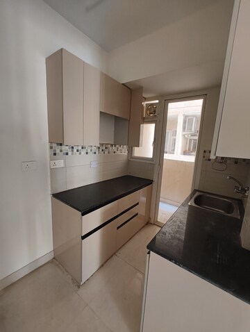 Kitchen in 2 BHK Apartment at Signature Global Orchard Avenue, Sector 93 – for Sale