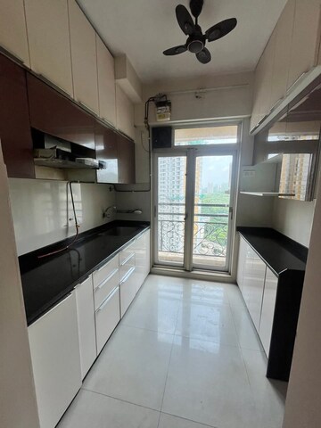 Kitchen in 2 BHK Apartment at Vijay Galaxy, Waghbil – for Rent