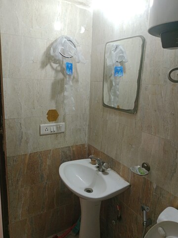 Bathroom in 2 BHK Apartment at Aims Golf City, Sector 75 – for Rent