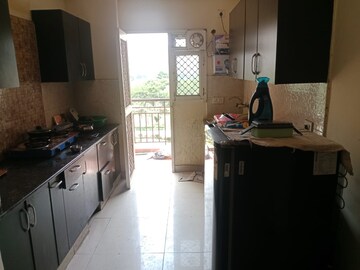 Kitchen in 2 BHK Apartment at Aims Golf City, Sector 75 – for Rent