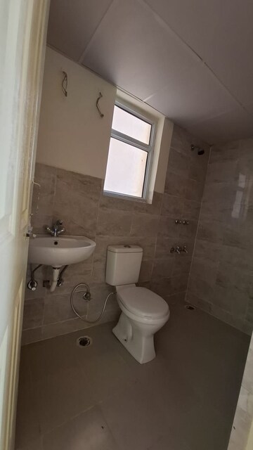 Bathroom in 2 BHK Apartment at Wave Dream Homes, Wave City – for Rent