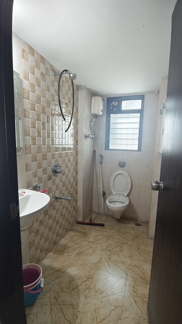 Bathroom in 2 BHK Apartment at Abhiram CHS, Kandivali West – for Rent