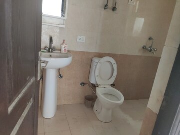 Bathroom in 3.5 BHK Apartment at Aims Golf City, Sector 75 – for Sale