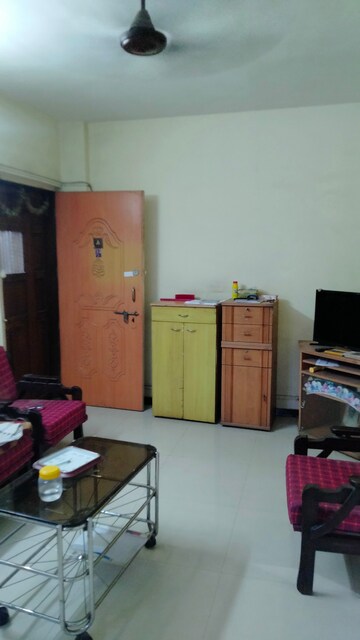 Living Room in 1 BHK Apartment at STC Employees CHS, Andheri East – for Rent