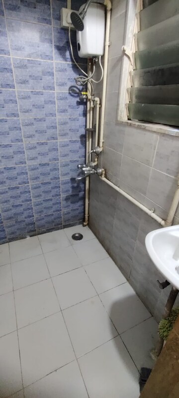Bathroom in 1 BHK Apartment at Omkar Vayu, Mahim – for Rent