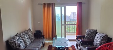 Living Room in 2 BHK Apartment at Mahagun Moderne, Sector 78 – for Rent